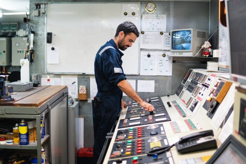 Marine engineer officer working in engine room